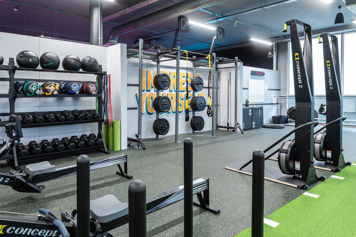 PureGym Walton-on-thames: Weight racks, benches, dumbbells, resistance machines, and rubberised flooring in a gym.