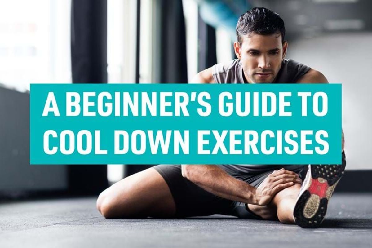 Man stretching leg on gym floor with text A beginner's guide to cool down exercises