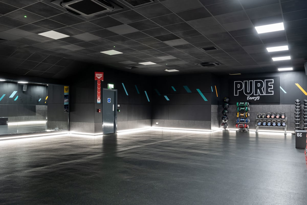 PureGym Newtownabbey: Training studio with kettlebells, free weights, medicine balls, mirrored walls and rubber flooring.