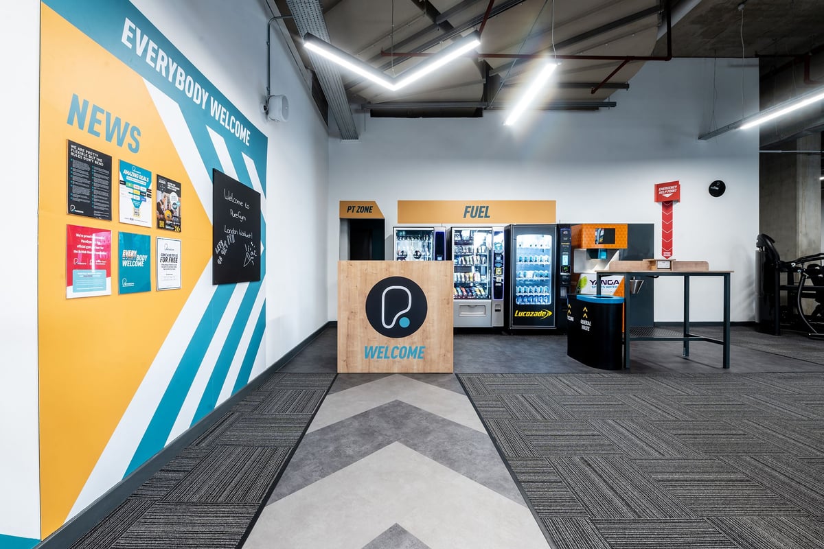 PureGym London Woolwich: Reception area with vending machines.