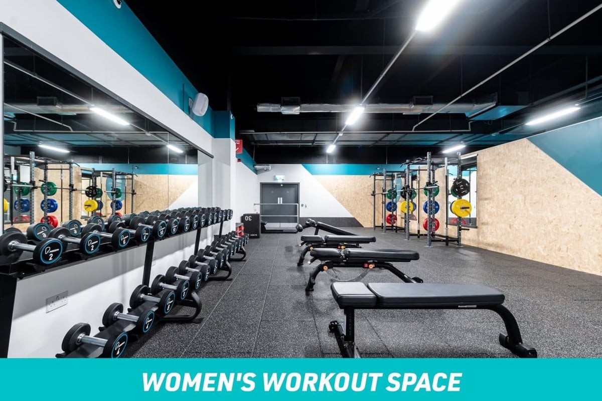 PureGym Bradford Thornbury: Women's workout space - benches and freeweights in a gym