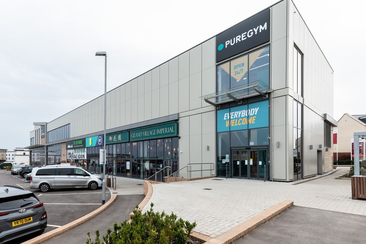 PureGym Bicester: Exterior of a gym facility showing signage and parking area.