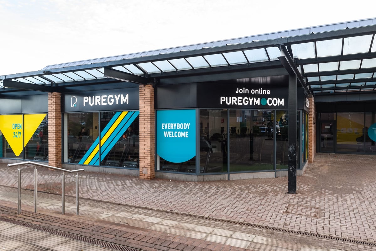 PureGym Telford: Exterior of gym with branded signage, glass frontage and brick facade.