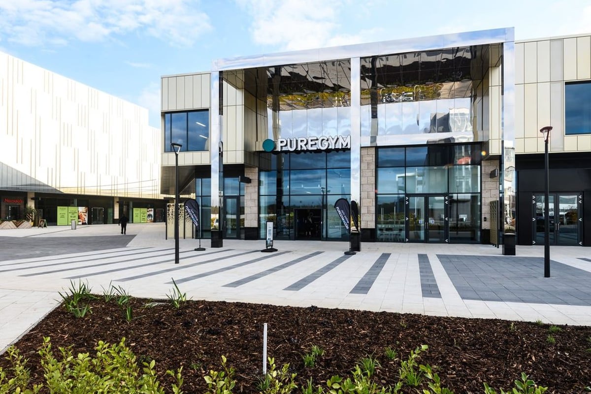 PureGym Leeds Thorpe Park: Modern gym building exterior with glass facade and 'PureGym' signage.