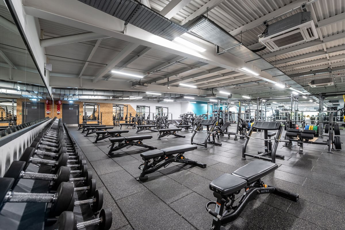 PureGym Manchester Cheetham Hill Retail Park: Resistance machines, free weights and benches in a well-equiped gym area.