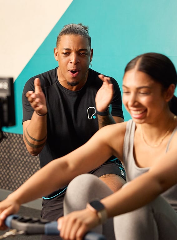 PureGym a smiling female and a male gym trainer