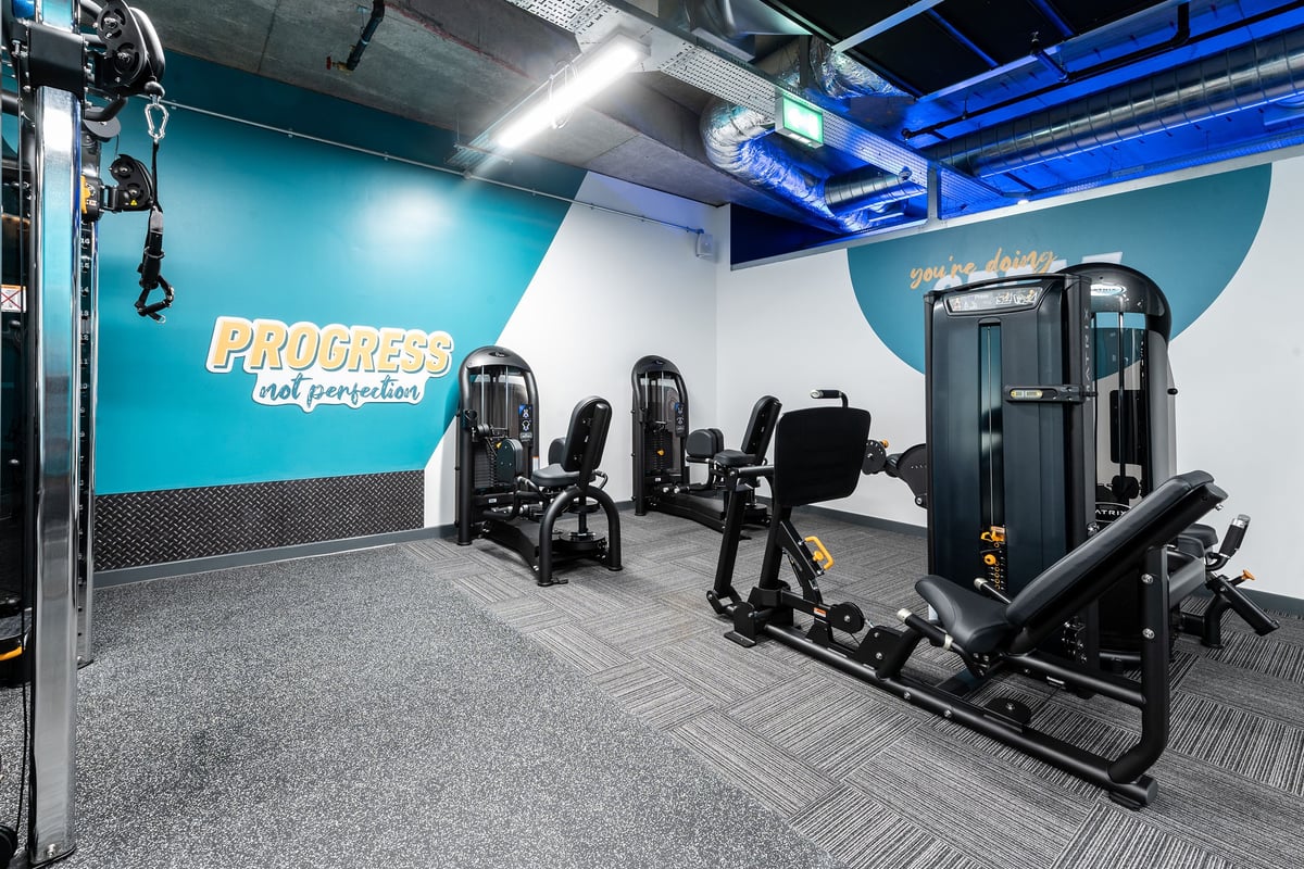 PureGym London Hoxton: Weight machines, resistance equipment, and rubberized flooring in a modern gym studio.
