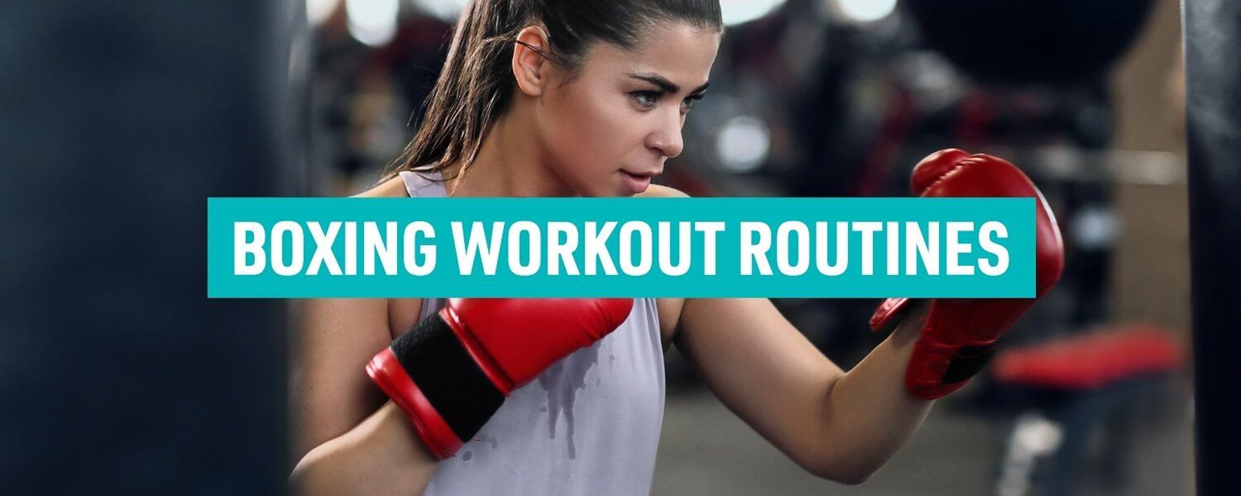 Woman in red boxing gloves training with punching bag in gym