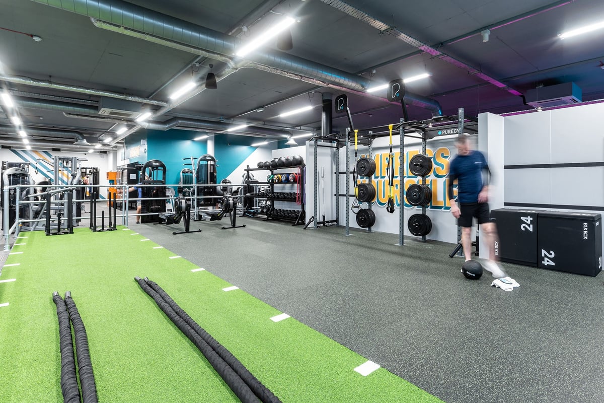 PureGym Walton-on-thames: Functional training area with weight racks, turf, resistance bands, and free weights visible.