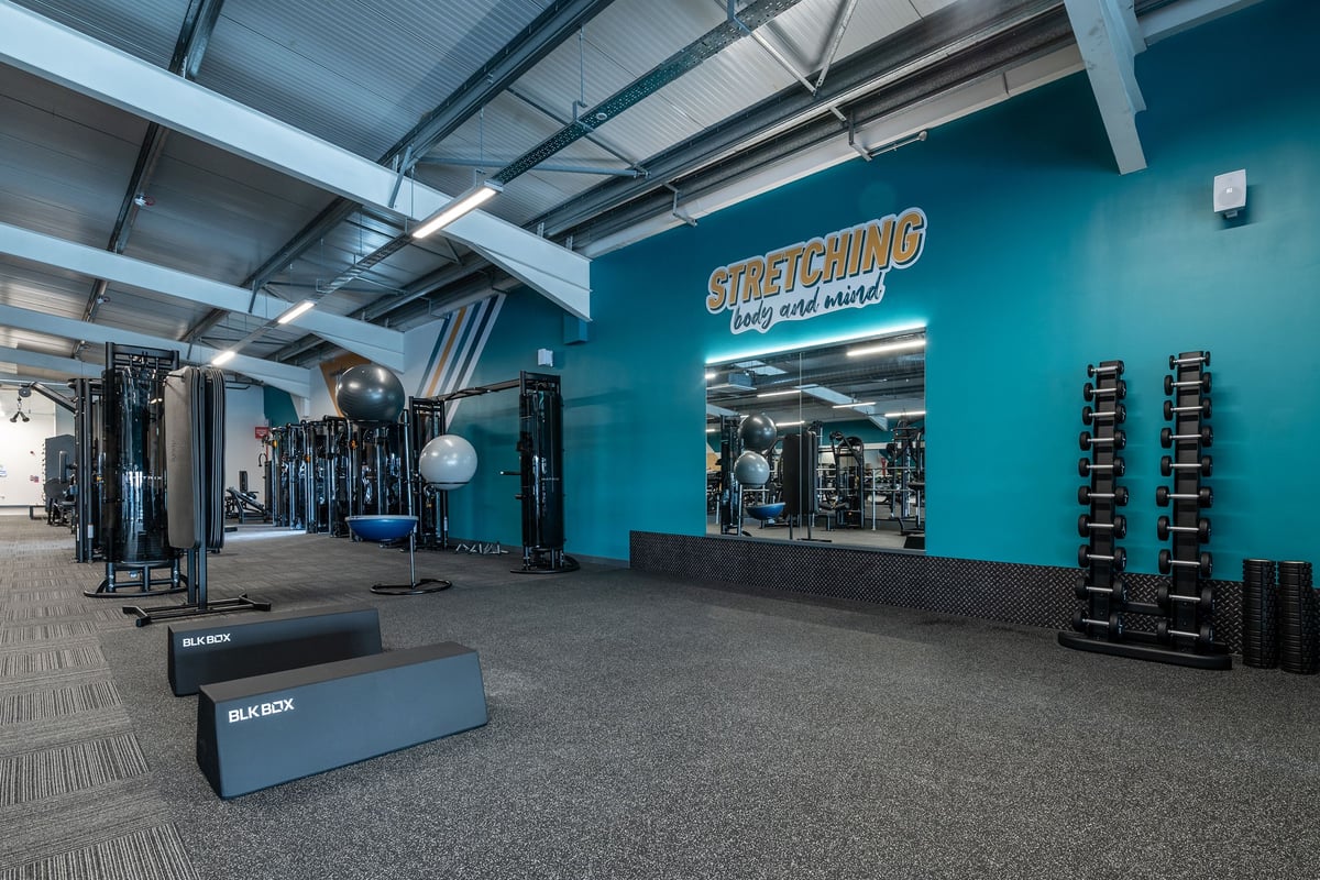 PureGym London Colney: Resistance machines, medicine balls, exercise boxes, and weighted sleds on rubberized flooring.