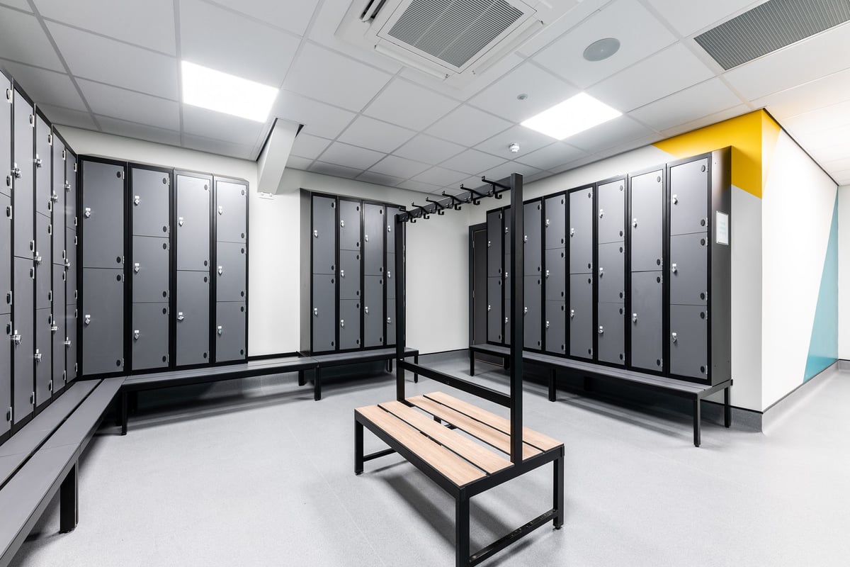 PureGym Broadstairs Westwood Gateway Retail Park: Rows of locker units, benches in the center of a changing room facility.