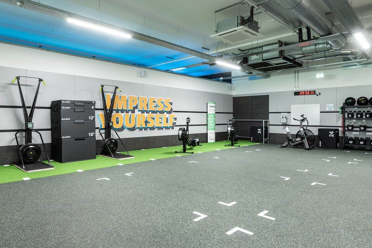 PureGym Witney: Skid-resistant flooring, sled pushers, suspension trainers, weight racks, and free weights.