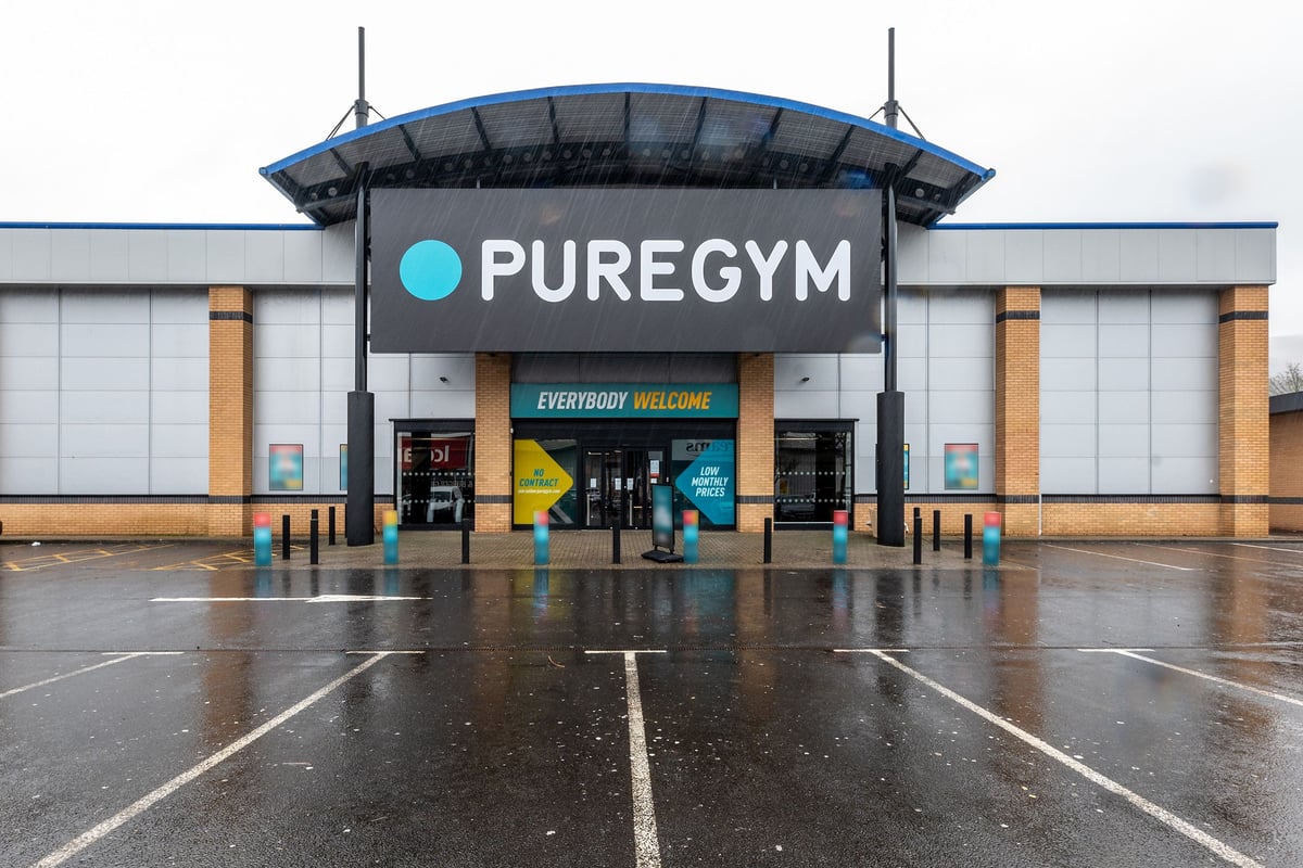 PureGym Merthyr Tydfil: Exterior of gym building with entrance canopy and parking area.