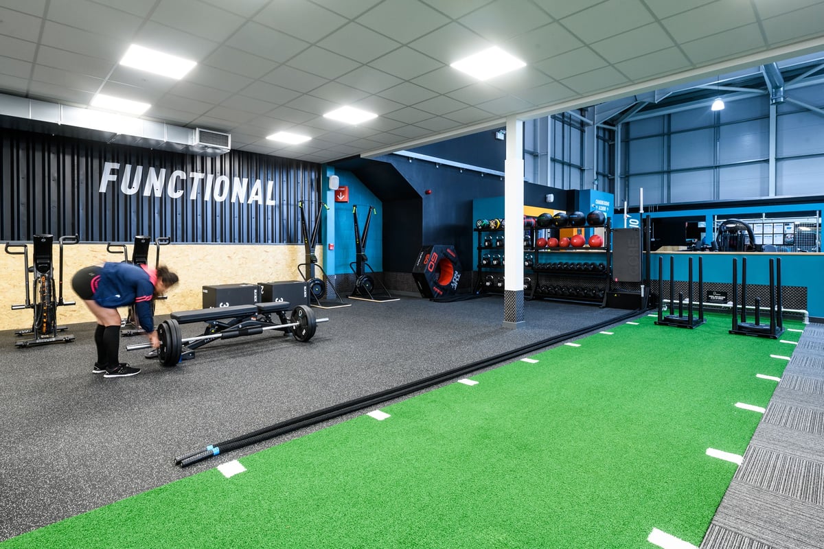 PureGym Lichfield: Functional training area with battle ropes, weight sleds, turf, free weights, and resistance bands.