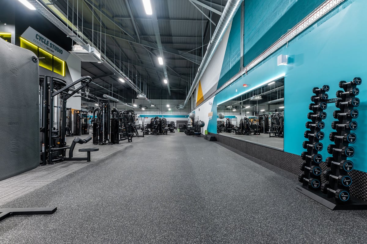 PureGym Sheffield Meadowhall Retail Park: Gym area with weight machines, free weights, benches, and rubberized flooring.