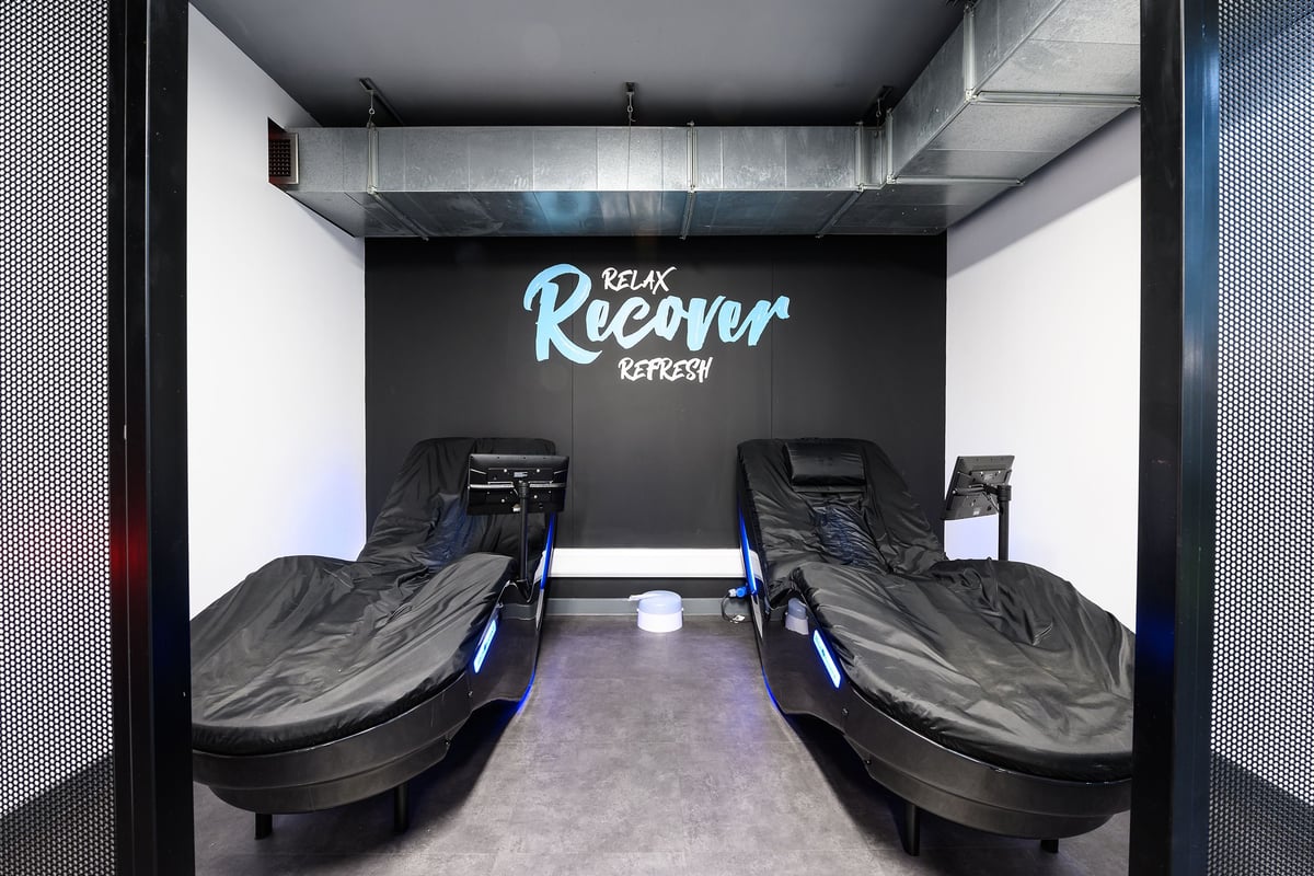 PureGym Reading Caversham Road: Reclined seating apparatus for recovery or relaxation purposes within a darkened enclosure.