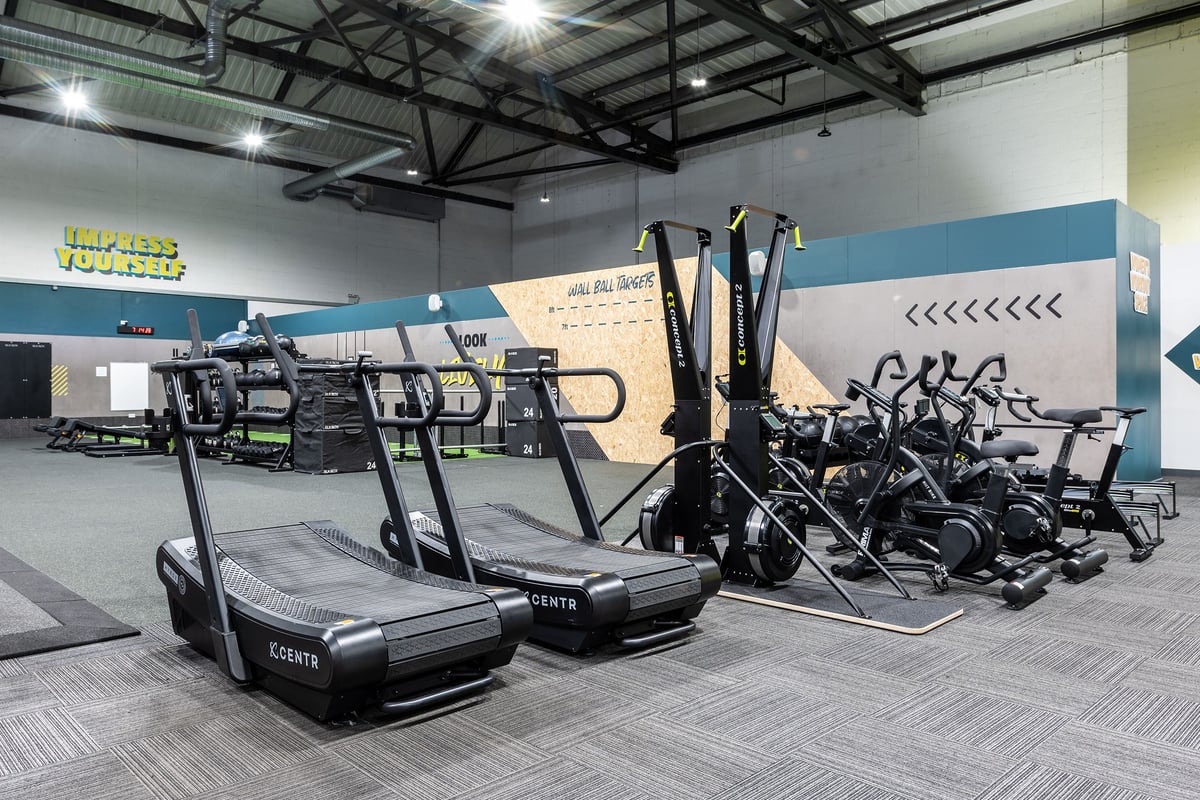 PureGym York: Rows of treadmills, elliptical trainers, exercise bikes alongside weight racks and strength machines.