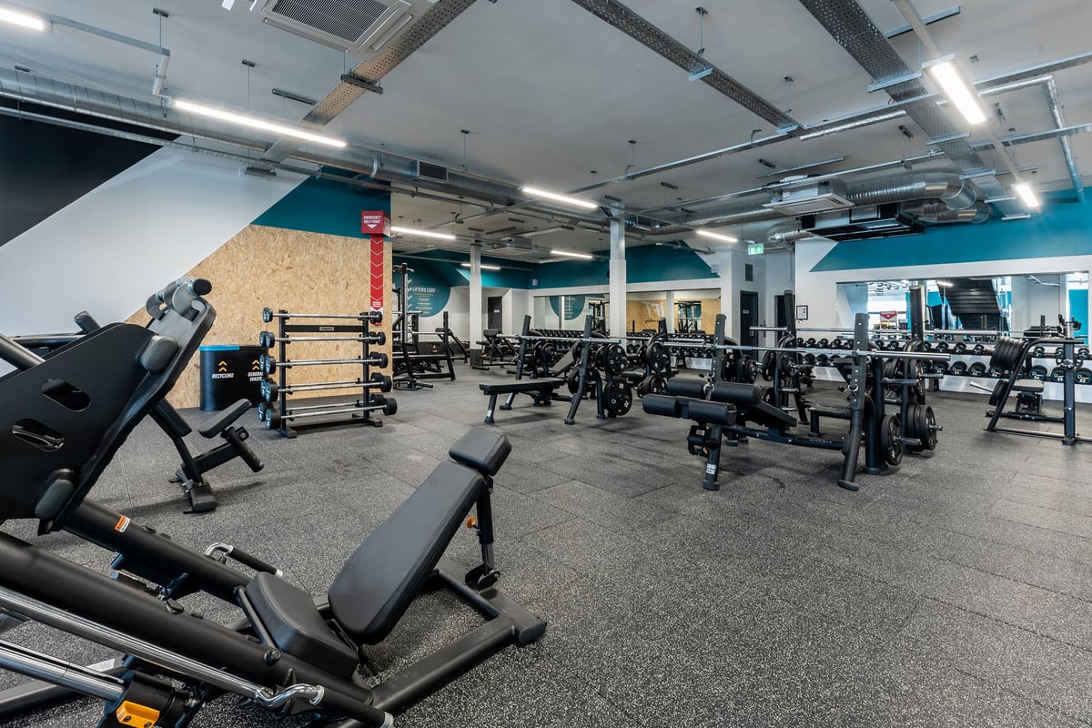 PureGym Crewe Grand Junction Retail Park: Gym with weight benches, free weights, squat racks, and rubberized floors.