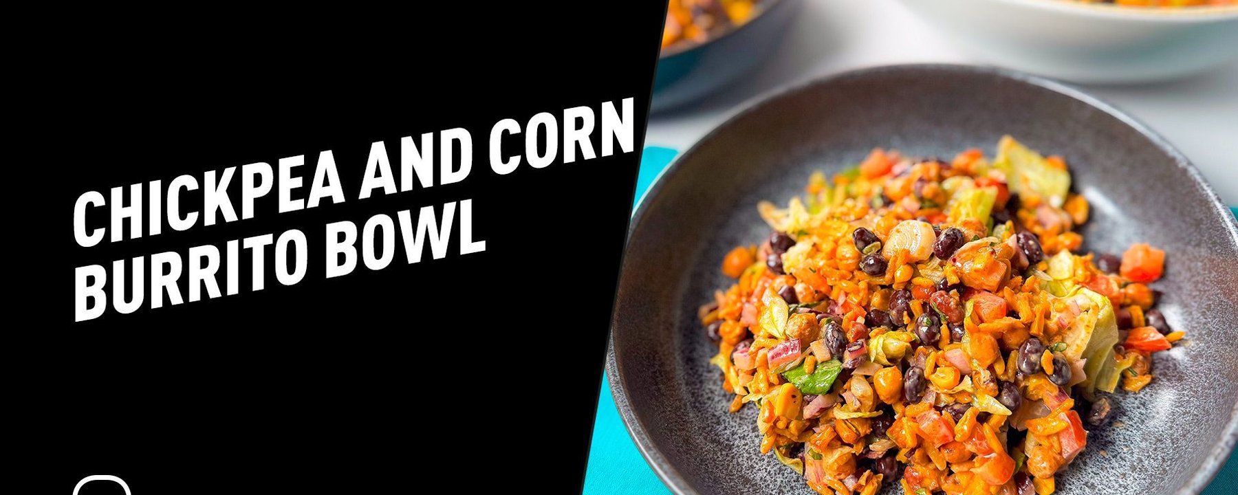 Chickpea and corn burrito bowl with black beans, rice, and vegetables in a grey bowl