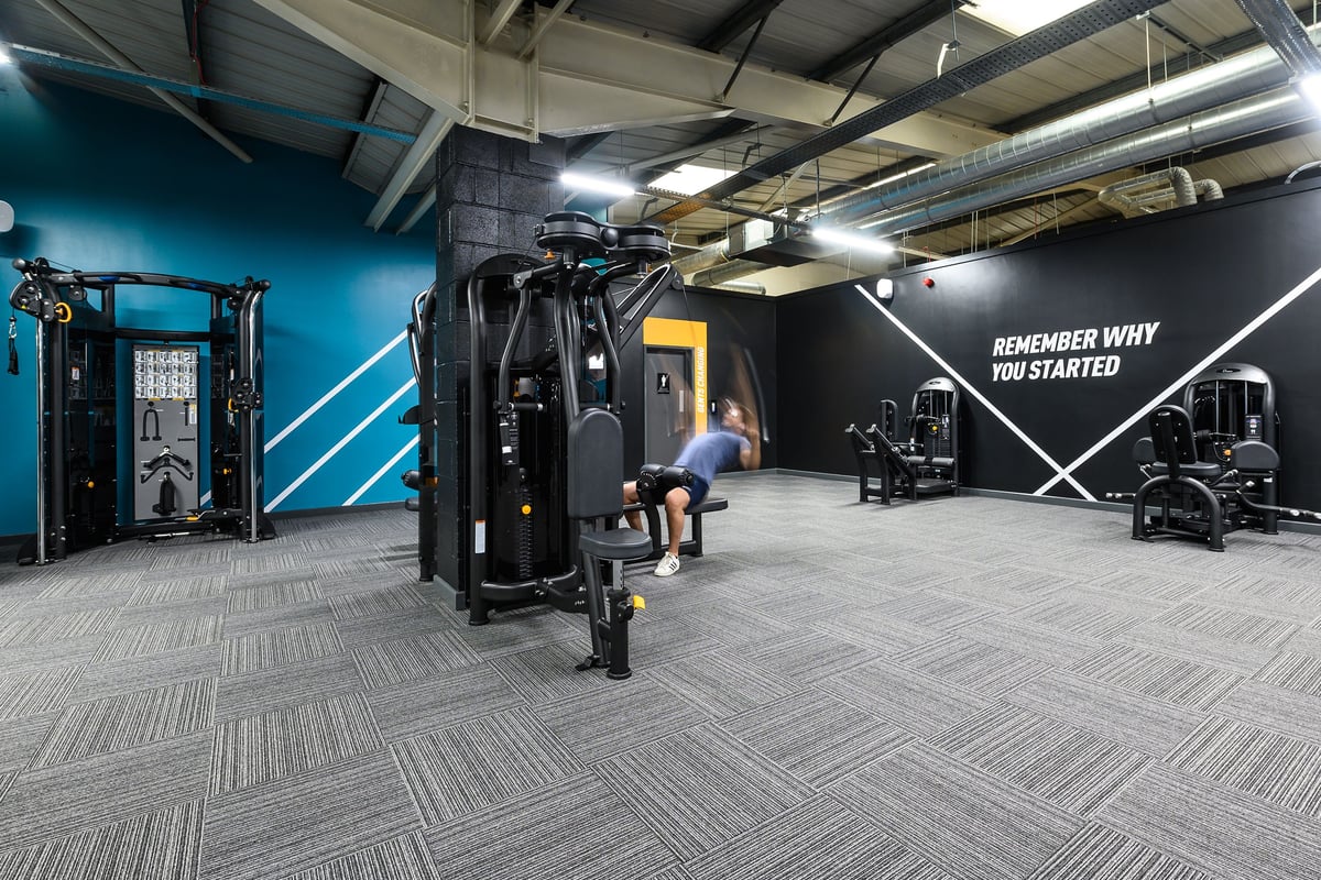 PureGym London Hayes: Strength racks, cable machines, benches, dumbbells, mirrors, and motivational wall signage.