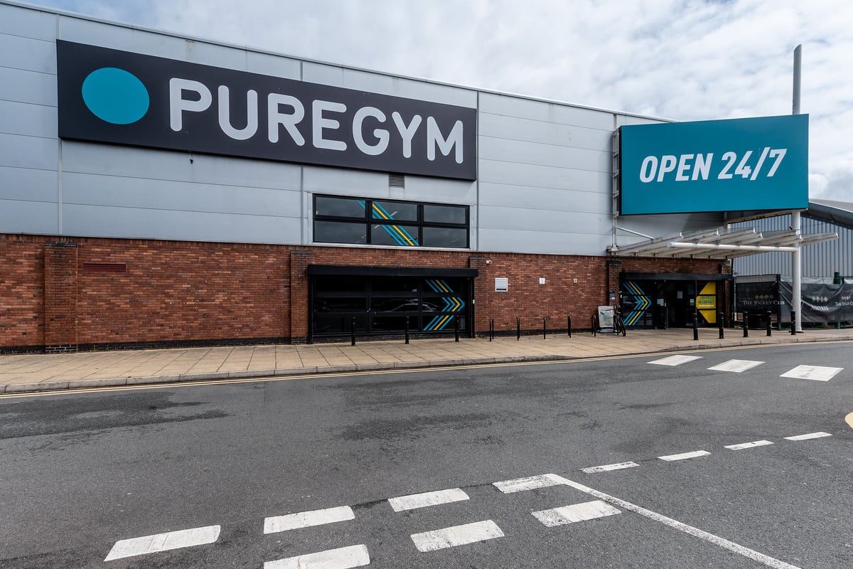 PureGym Aintree: Exterior of a gym facility with signage "PUREGYM" and "OPEN 24/7" visible.