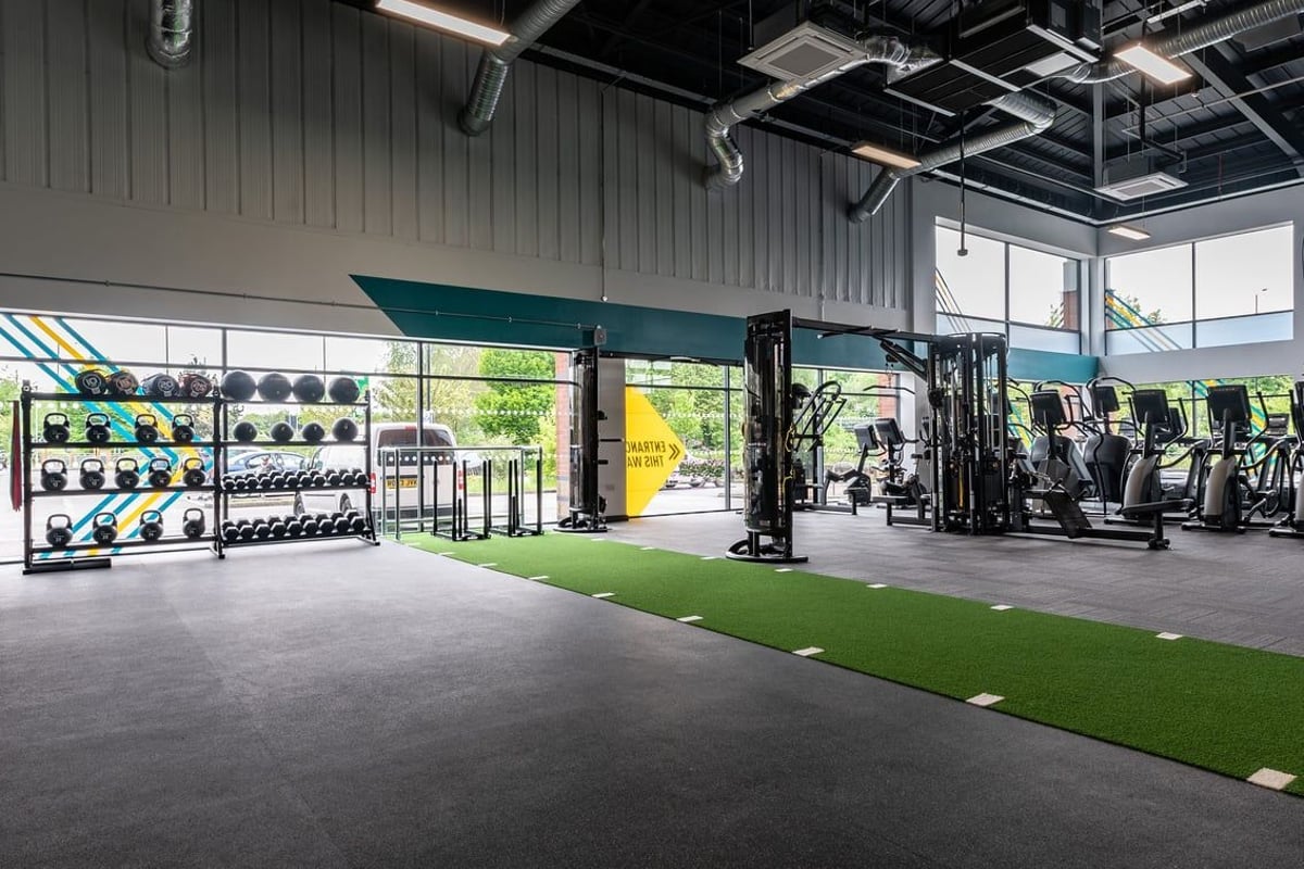 PureGym Doncaster: Weight racks, medicine balls, rubberised flooring, turf area in spacious gym studio.