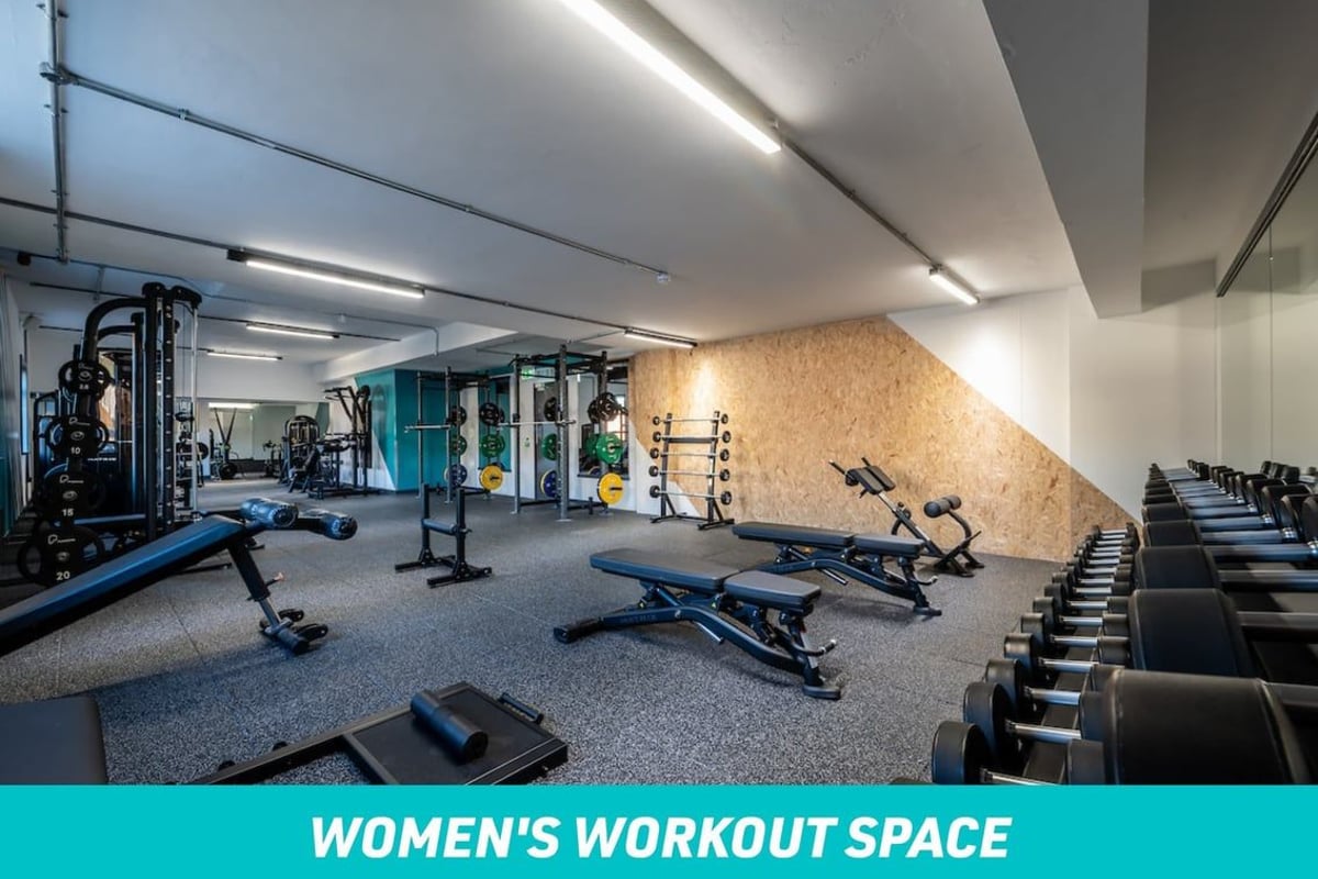 PureGym Southampton Bitterne: Women's Workout space with benches and free weights in a gym