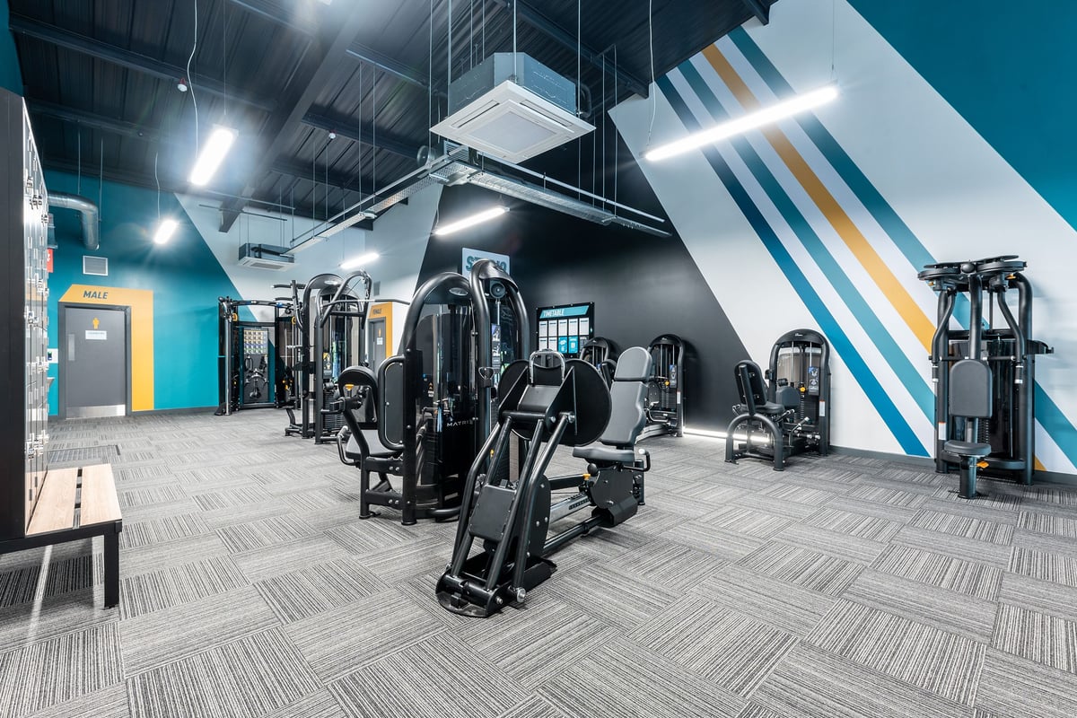 PureGym Doncaster: Resistance machines, freeweights, mirrored walls, industrial-style gym interior.