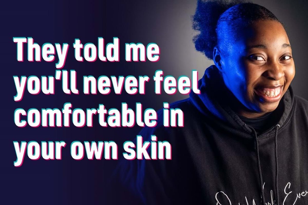 Smiling person in black hoodie with text about feeling comfortable in your own skin