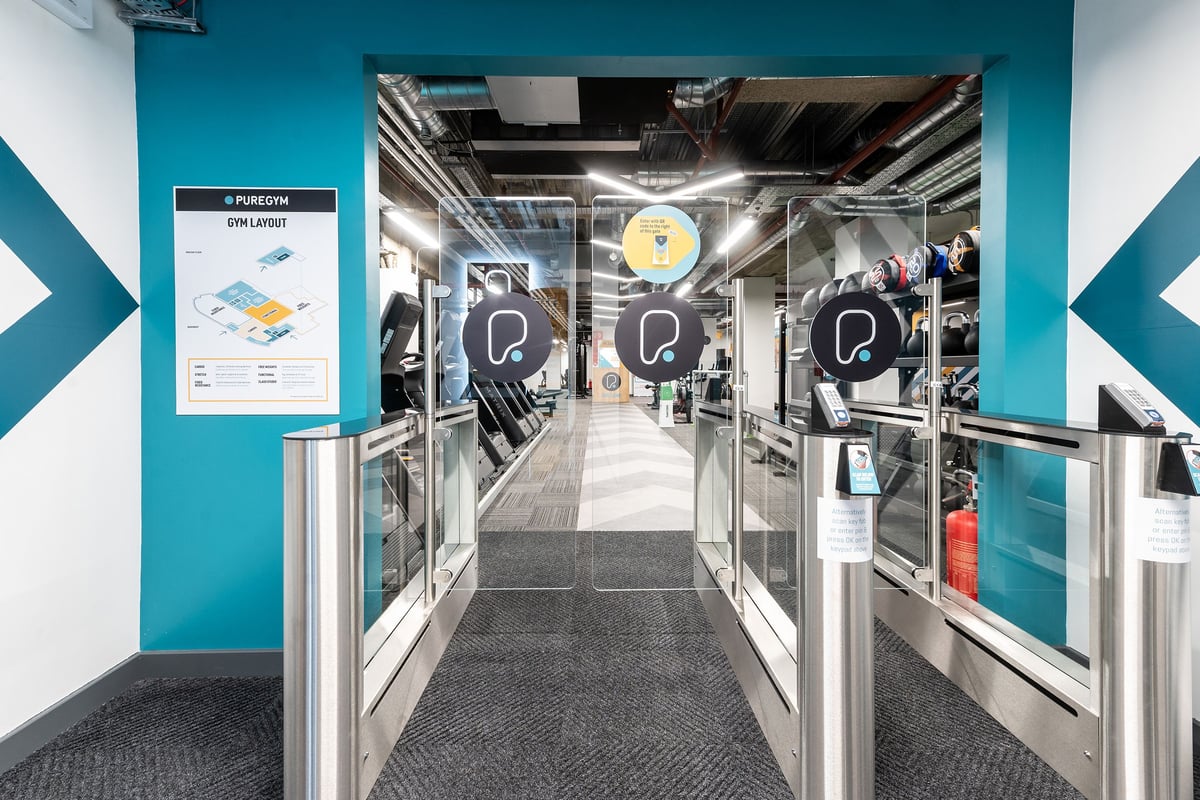 PureGym London Monument: Cardio, weight equipment, and resistance machines visible through the entry gates.