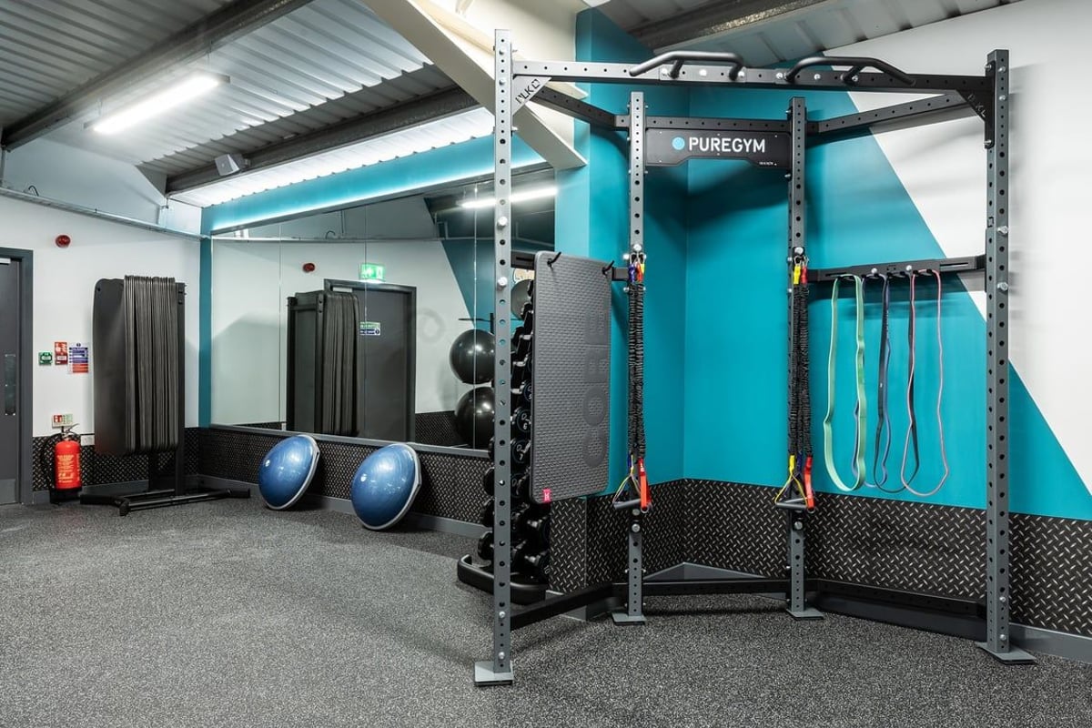 PureGym Macclesfield Silk Road: Puregyms studio with rack, suspension trainers, med balls, and rubberized flooring.