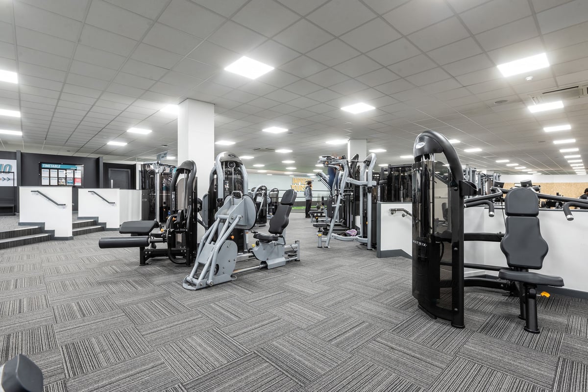 PureGym Birmingham Beaufort Park: Spacious training floor with a variety of resistance machines.