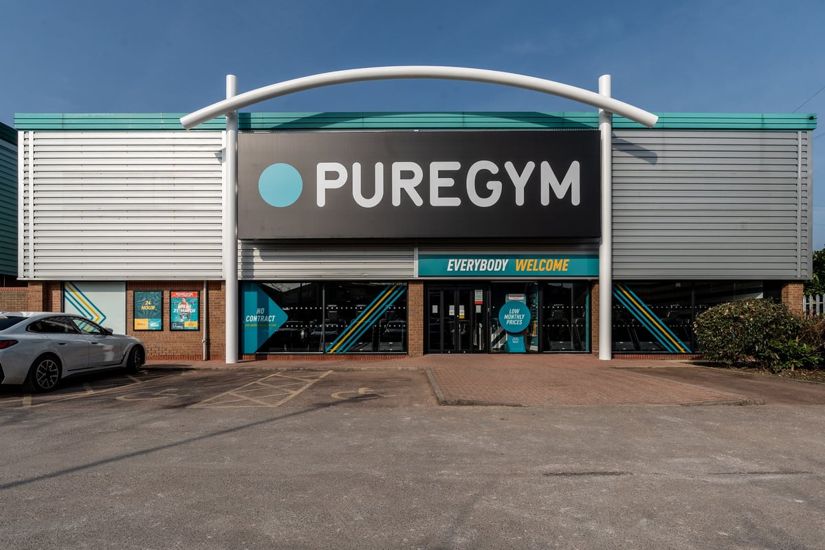 PureGym Keighley: Storefront with gym's logo, windows showcasing exercise equipment inside.