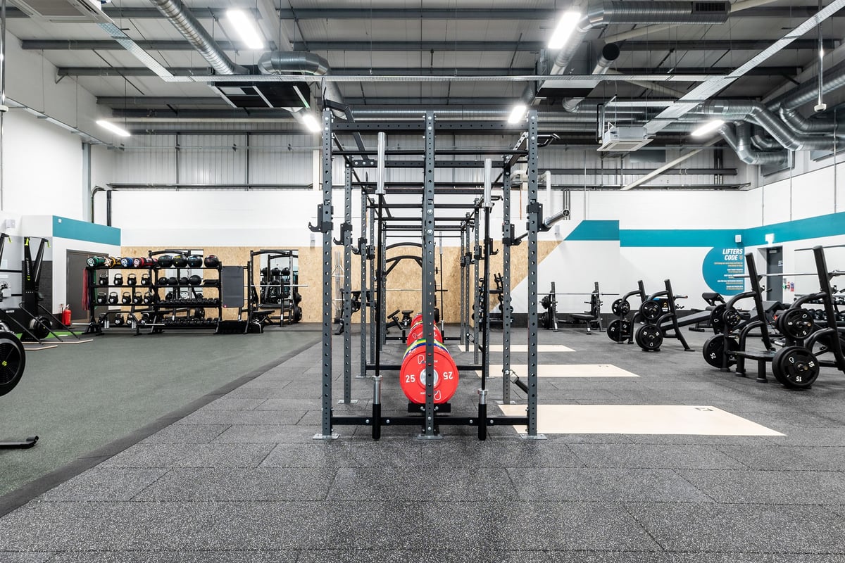 PureGym Great Yarmouth: Rig frames, weight racks, resistance machines, rubberized floor, industrial interior.