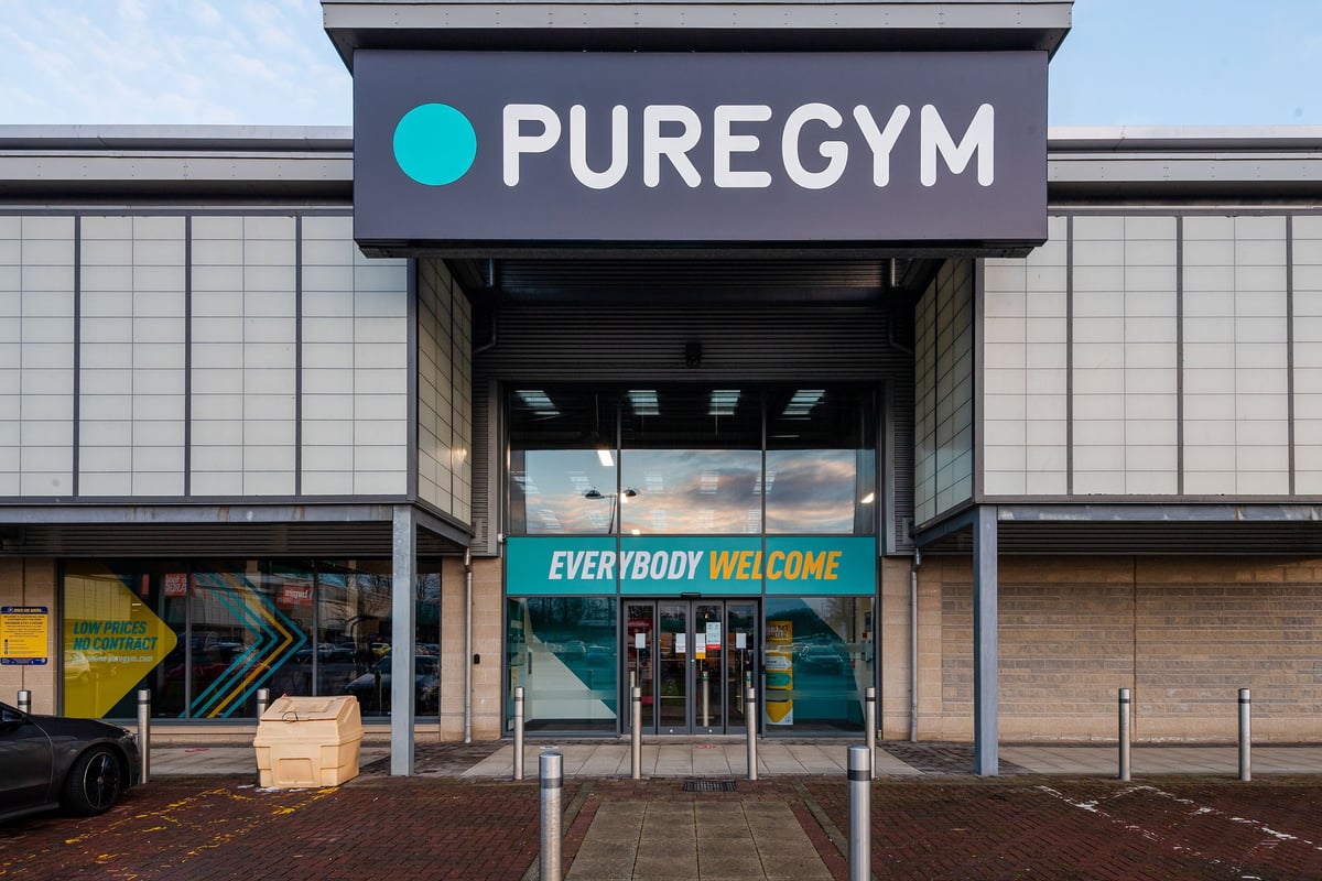 PureGym Elgin: Gym entrance with large text "PUREGYM" and "EVERYBODY WELCOME" displayed prominently.