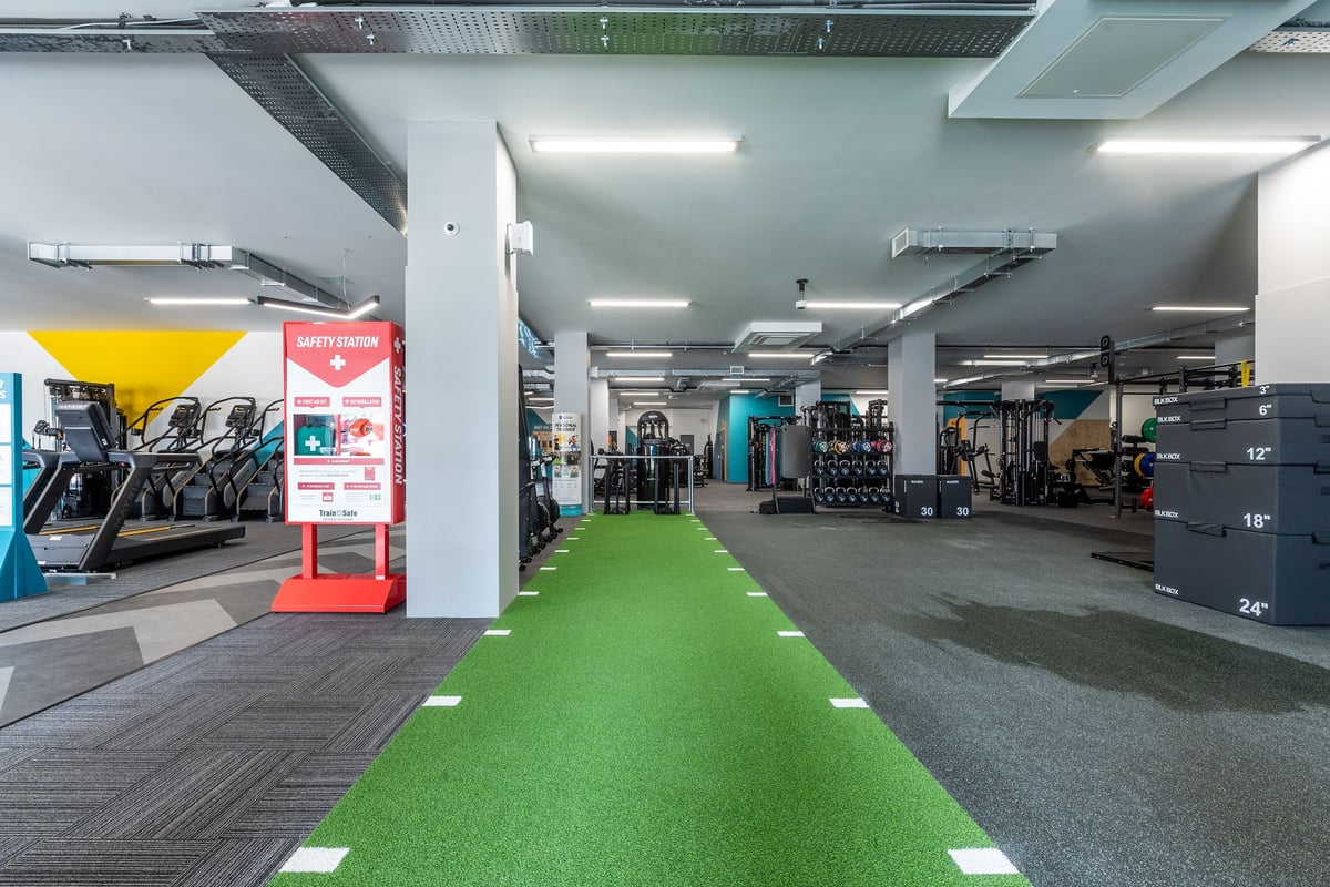 PureGym Coalville: Treadmills, exercise bikes, strength equipment, free weights, green turf area for functional training.