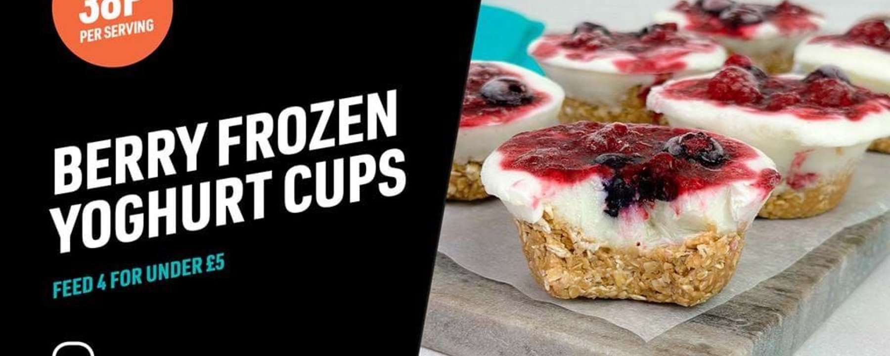 Berry frozen yoghurt cups with granola base and mixed berry topping on a tray