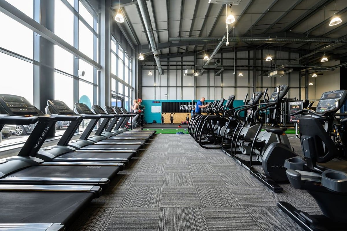 PureGym Maldon Blackwater Retail Park: Rows of treadmills, ellipticals, and exercise bikes in a bright gym studio.