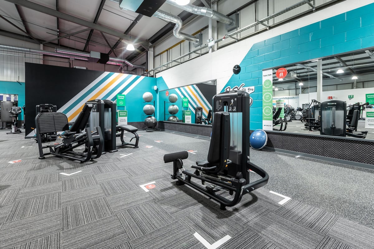 PureGym Swindon Stratton: Resistance machines, free weights, exercise balls, and rubberised flooring in a vibrant gym studio.