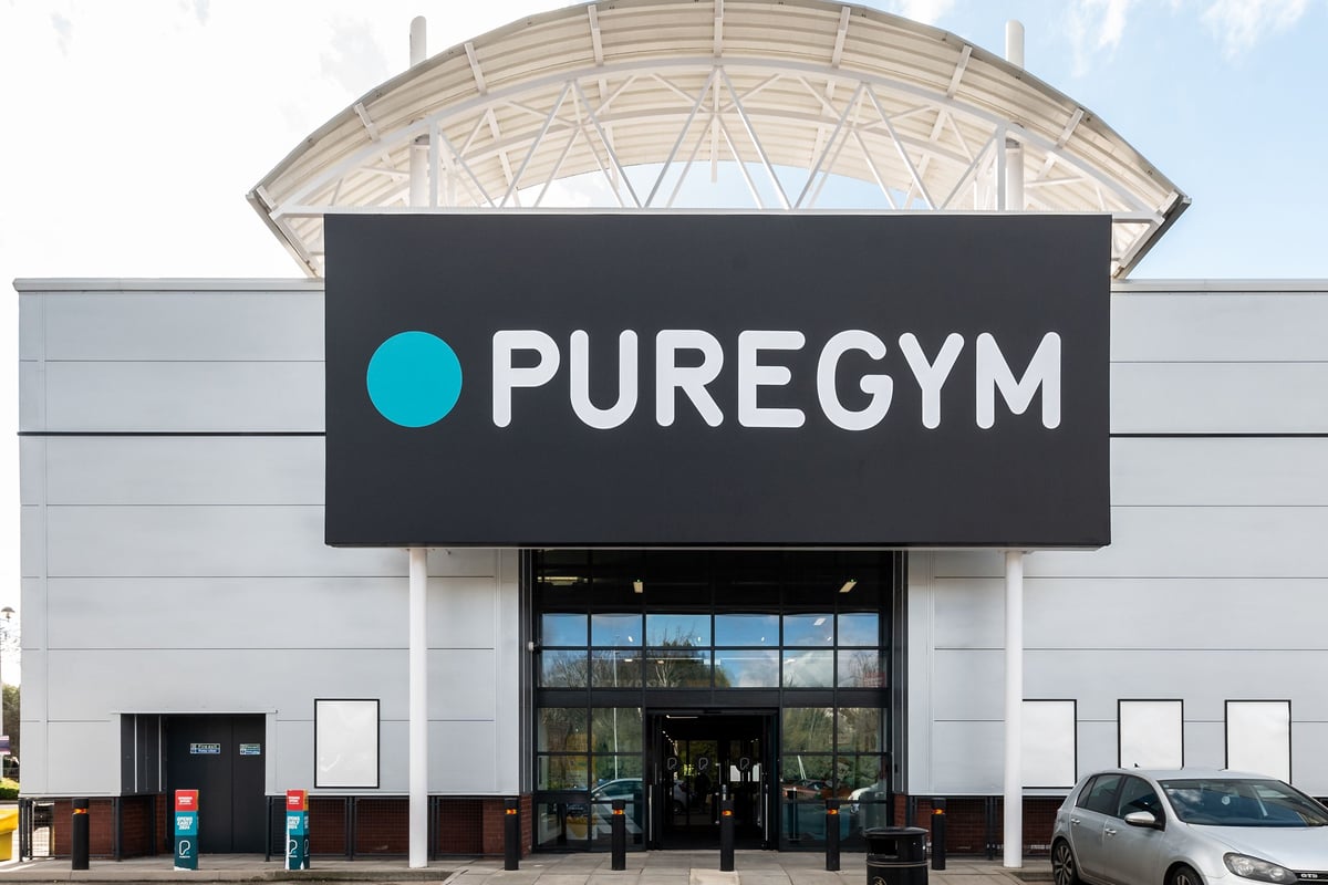 PureGym Kettering: Puregym logo on exterior building facade with glass entrance.