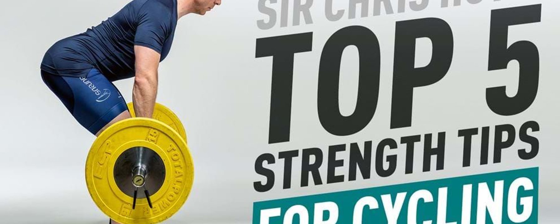 Man in cycling gear lifting a barbell with yellow weights against white background
