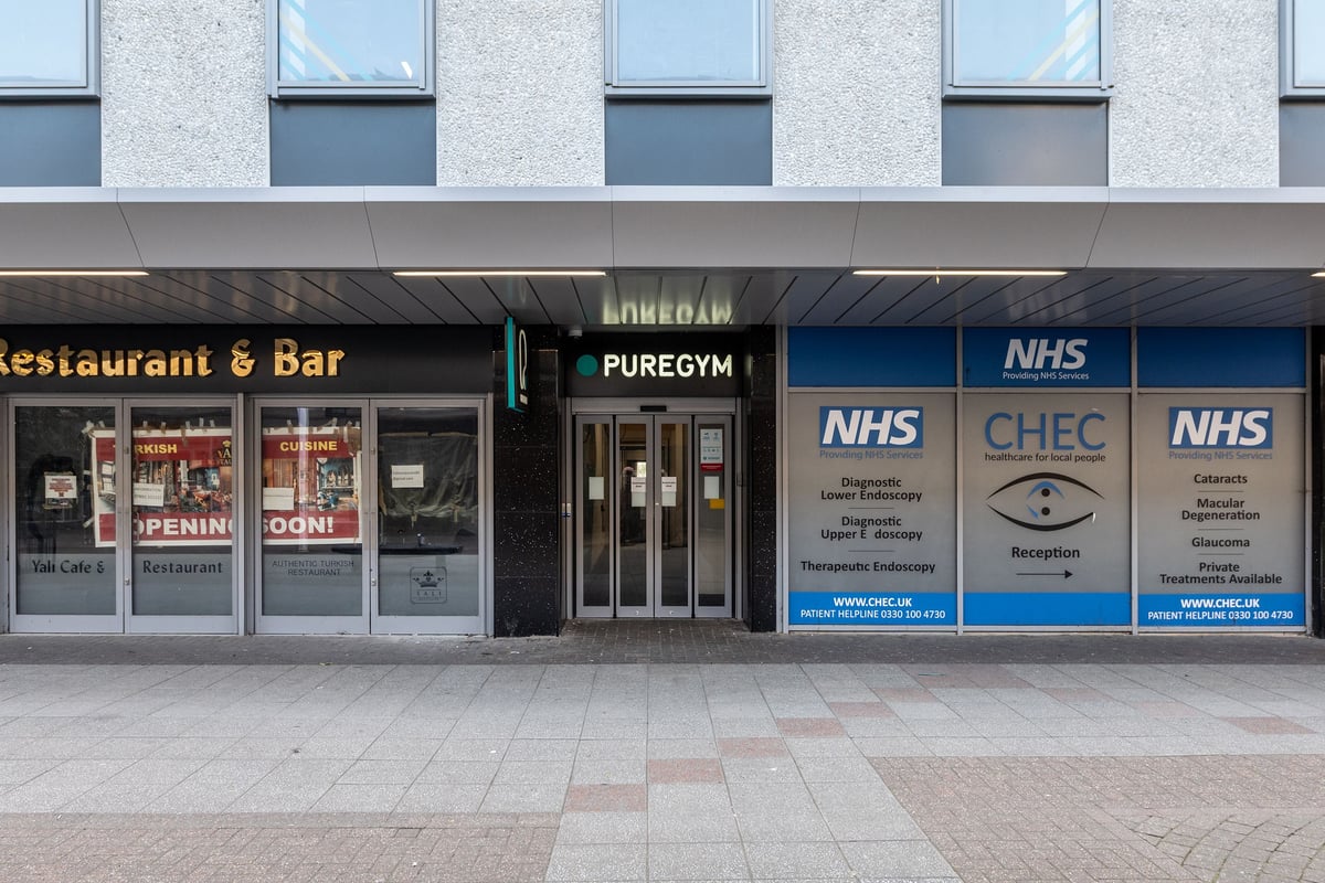 PureGym Stevenage: Street entrance to PureGym with signage and sliding doors.