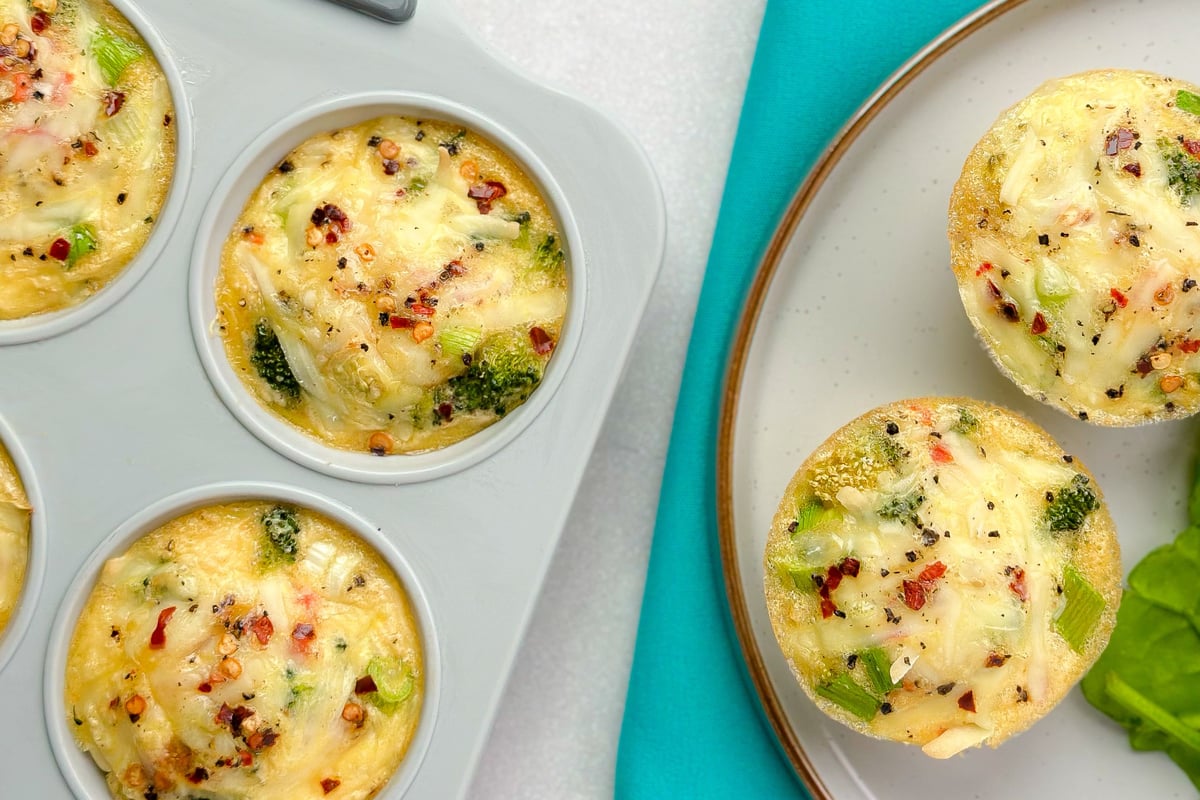 Egg muffins with broccoli and cheese in white ramekins and on plates