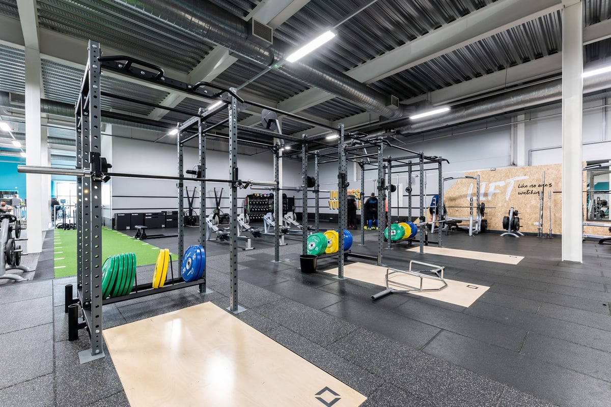 PureGym Hednesford Cannock: Rig cages, weight plates, rubberised floors, and racking for weightlifting equipment.