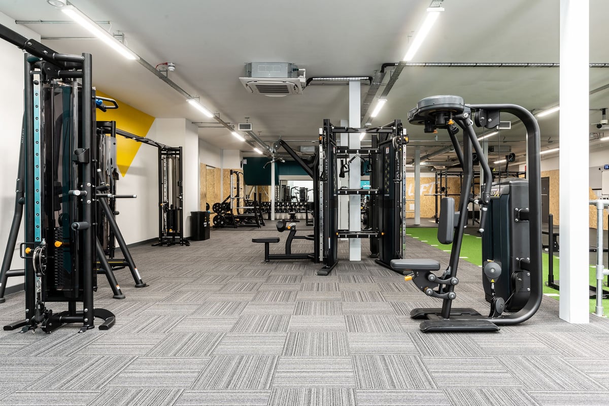 PureGym Northallerton: Weight machines, resistance cables, floor mats in a well-equipped gym space.