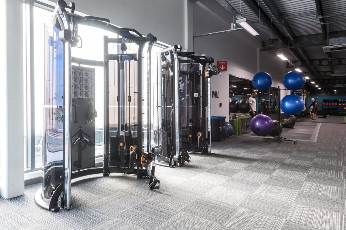 PureGym Leeds Thorpe Park: Multi-station functional trainers, resistance machines, exercise balls in a modern gym interior.