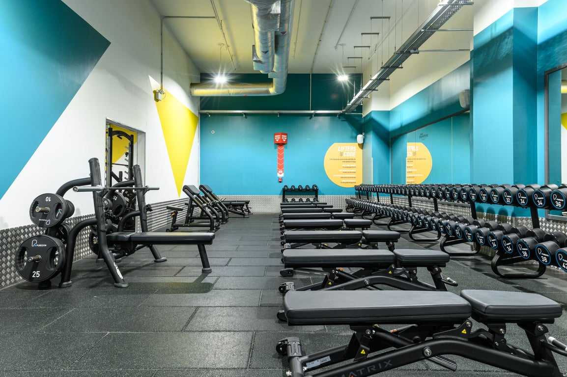 PureGym East Kilbride: rows of benches in a gym on a rubberised floor