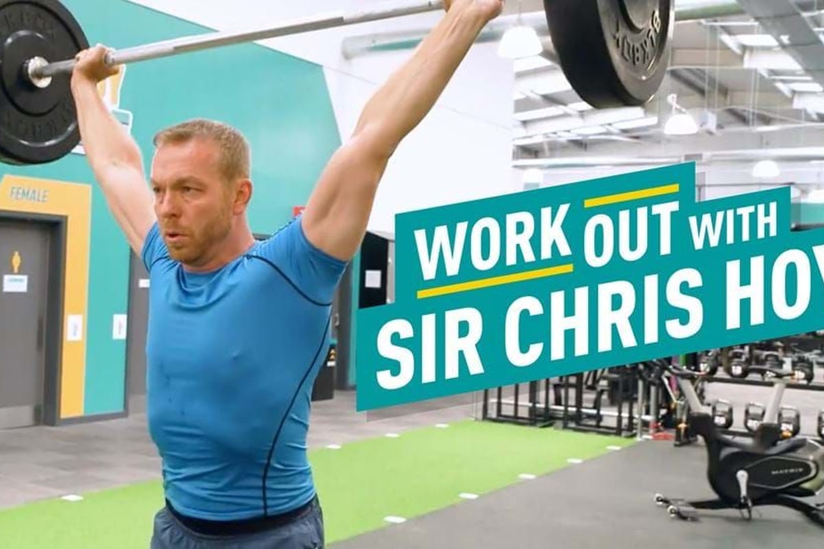 Man lifting barbell overhead in gym with workout text beside him