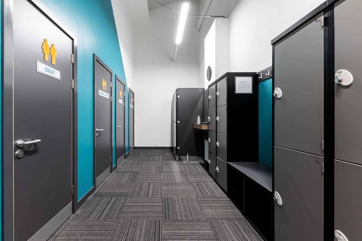 PureGym Uttoxeter: Men's and women's restrooms with cubicles and hand washing facilities.