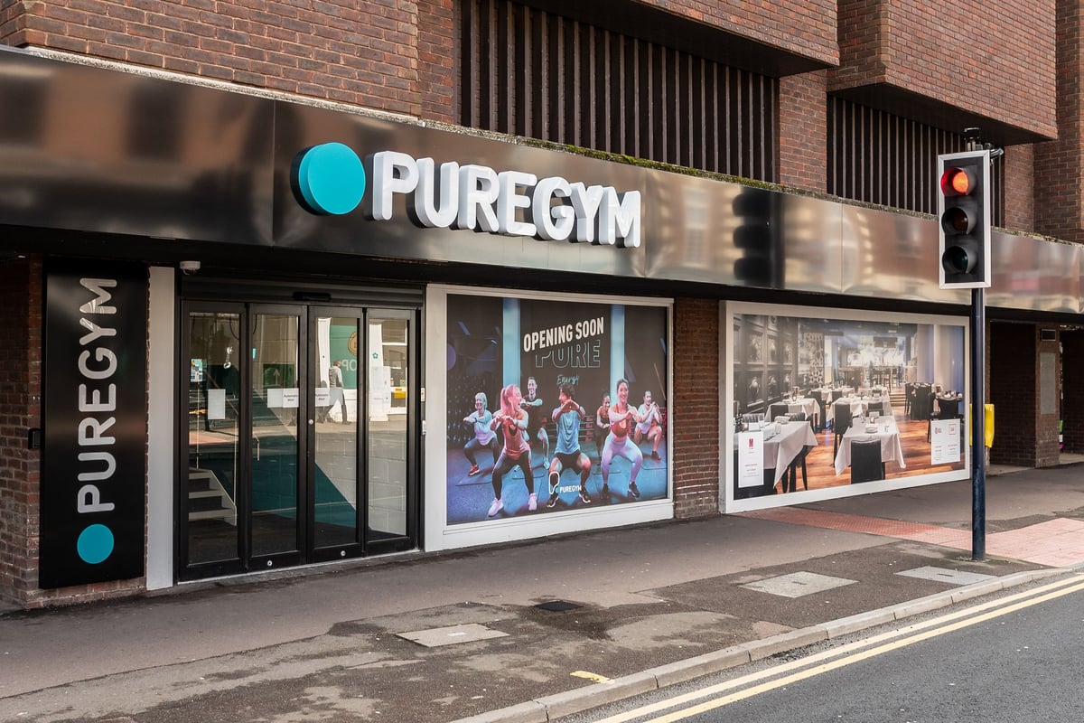 PureGym Maidstone The Mall: Gym storefront with logo signage, display windows showing fitness classes.